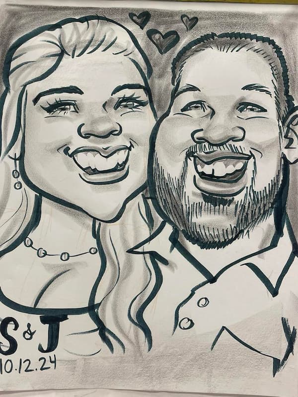 A close up of a caricature of a bride and groom. They are smiling with hearts floating in between them.